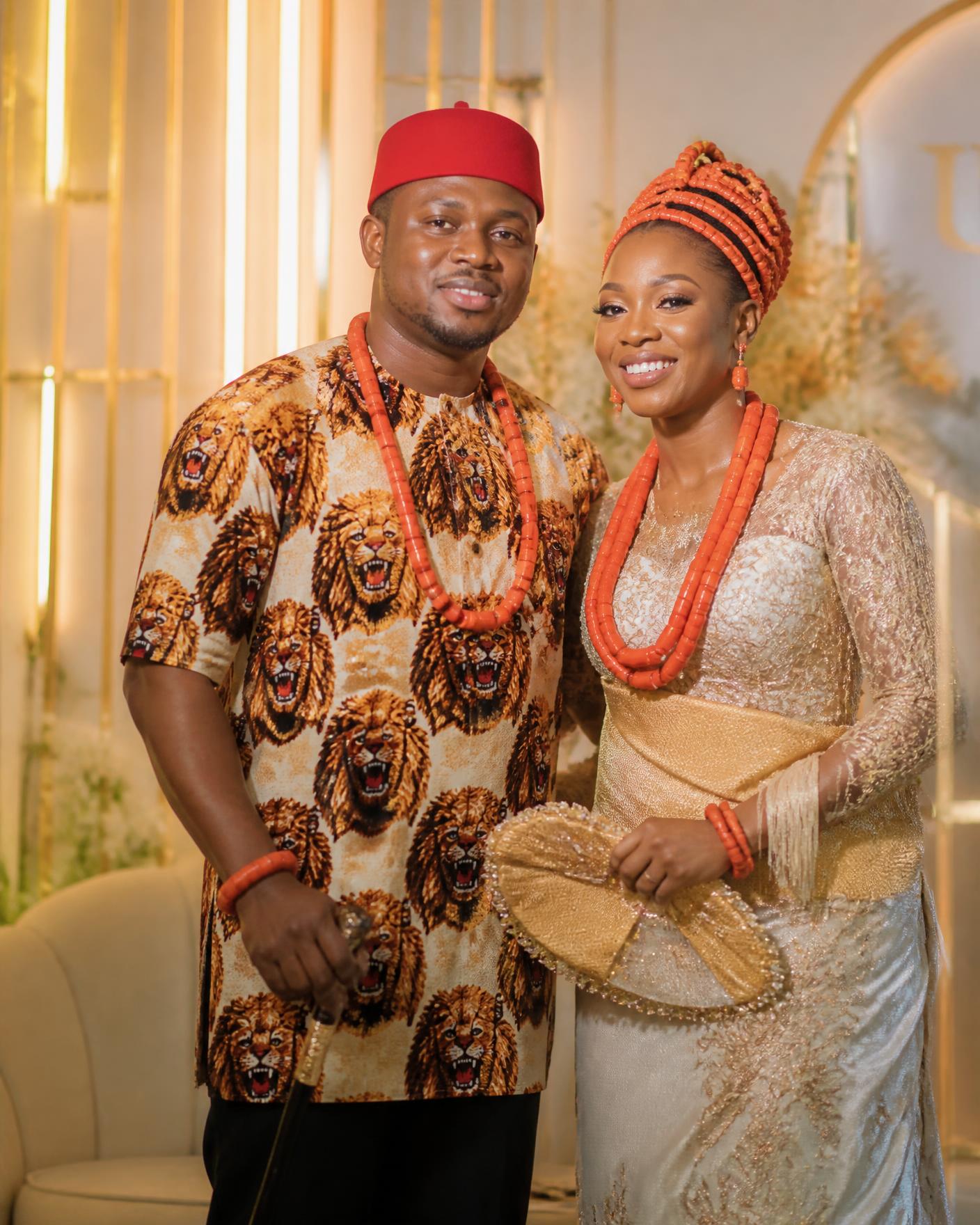 Igbo couple in isi agu and coral beads at their traditional wedding